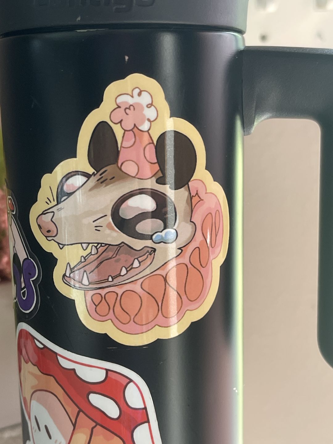 Customer photo review of Sad Party Opossum Stickers!