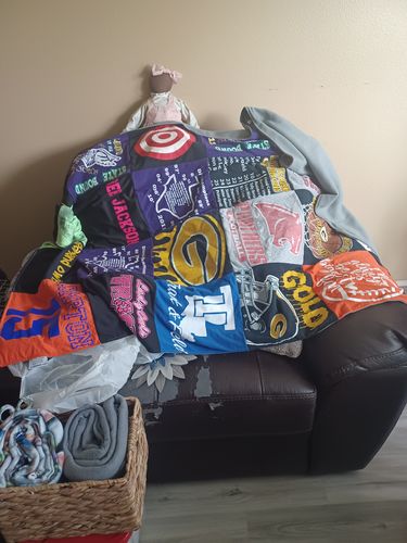 T-shirt quilt with sports, crafting themes by Shirl from TX