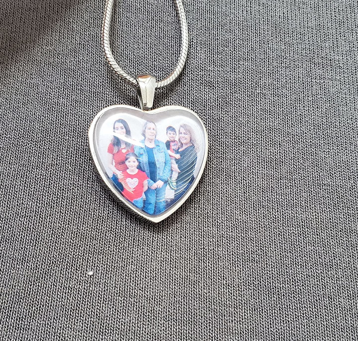 Customer photo review of Photo Cremation Urn Necklace for Ashes Custom Engraving Pendant with Filling Tool