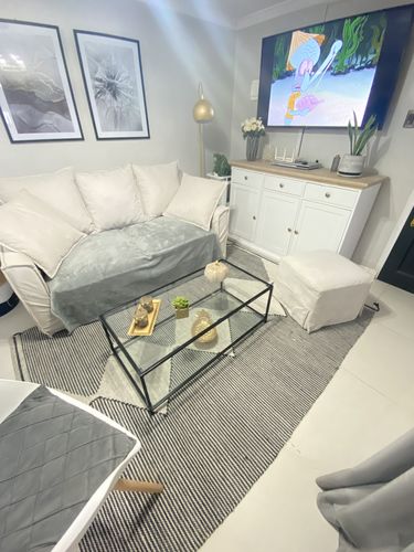 Customer photo review of Mesa de centro Rectangular 100 NEGRA dos niveles GLASS
