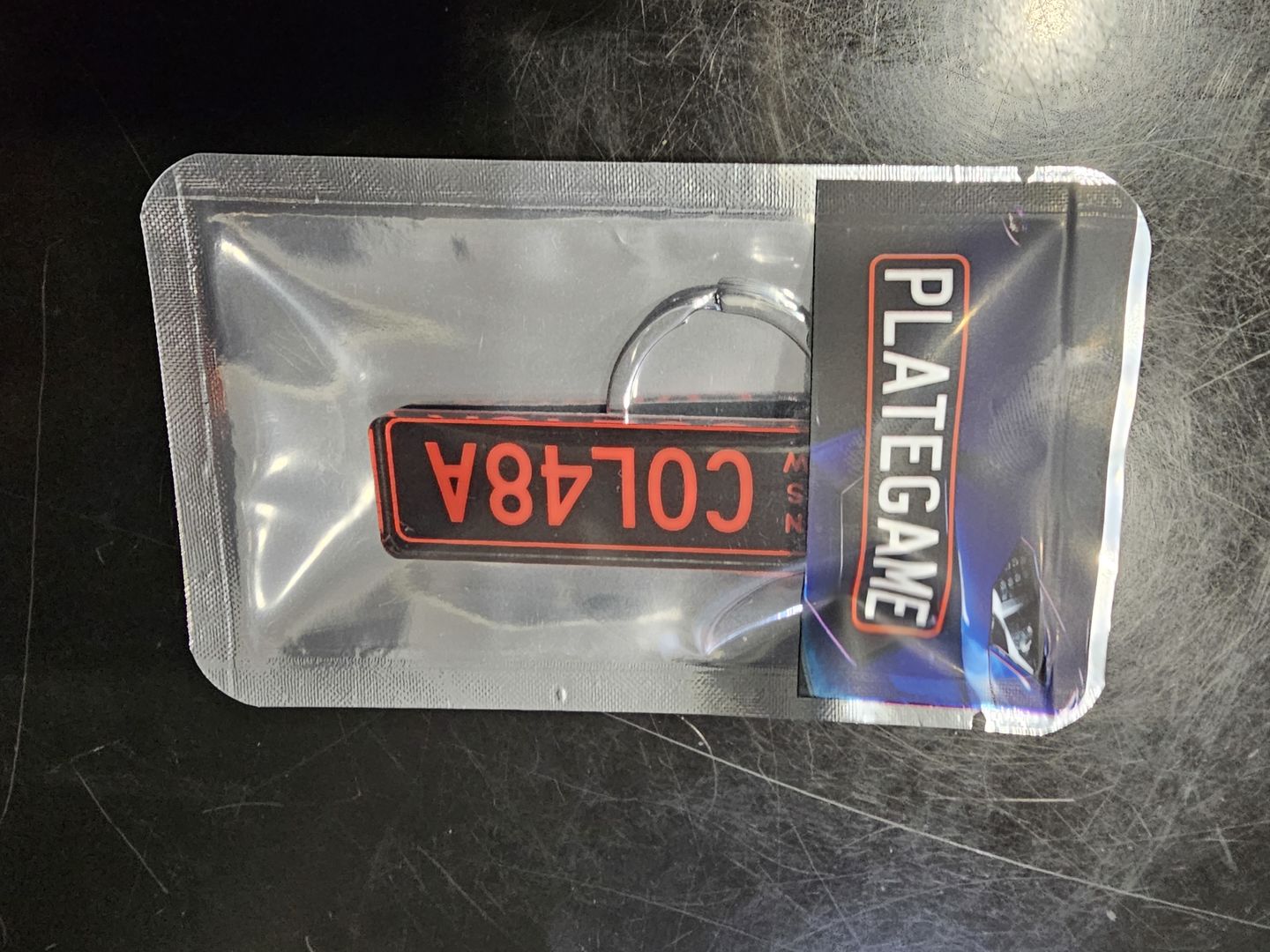 Customer photo review of NSW Colour on Black Licence Plate Custom Keychain