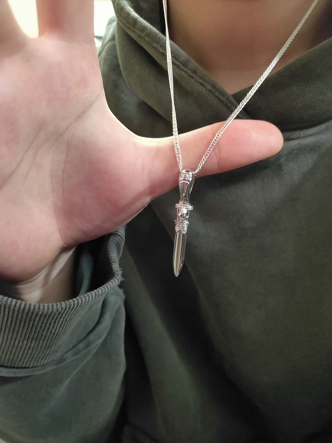 Customer photo review of CATACOMB SWORD PENDANT