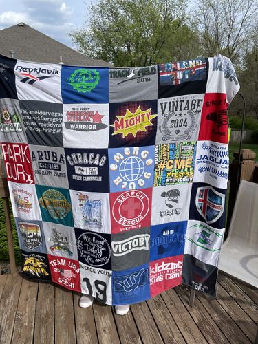 T-shirt quilt with travel, sports themes by Debra from MO