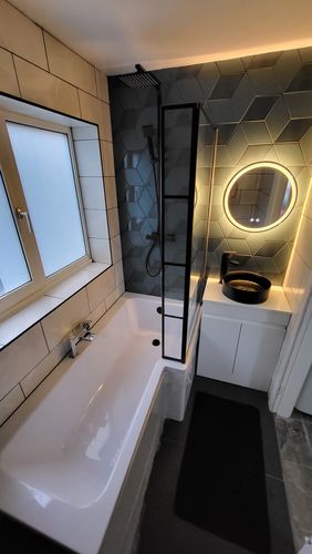 Customer photo review of L-Shaped 1700 x 850/700 Shower Bath C/W Black Abstract Bath Screen & Front Panel