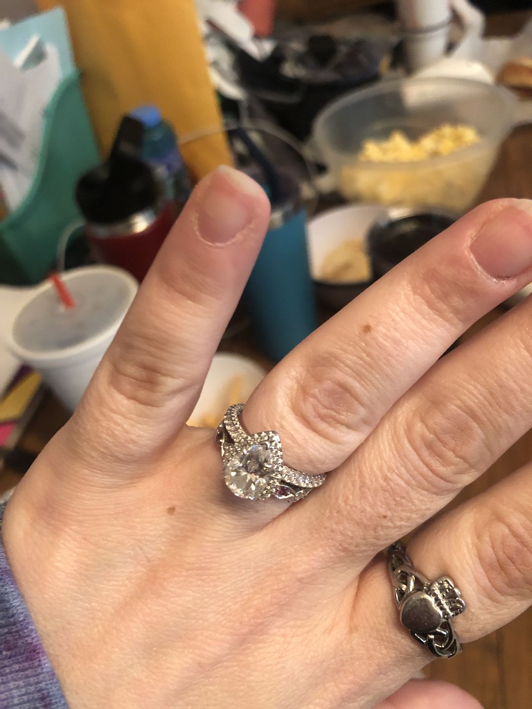 Customer photo review of Halo Pear Moissanite Triple Row Pave Engagement Ring