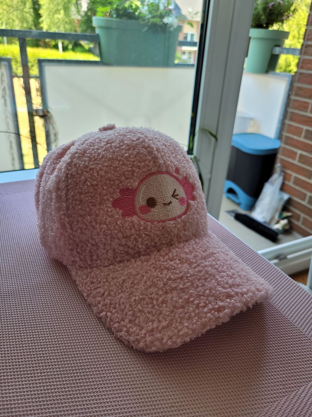 Customer photo review of Xoxi The Axolotl Wink Embroidered Fluffy Cap