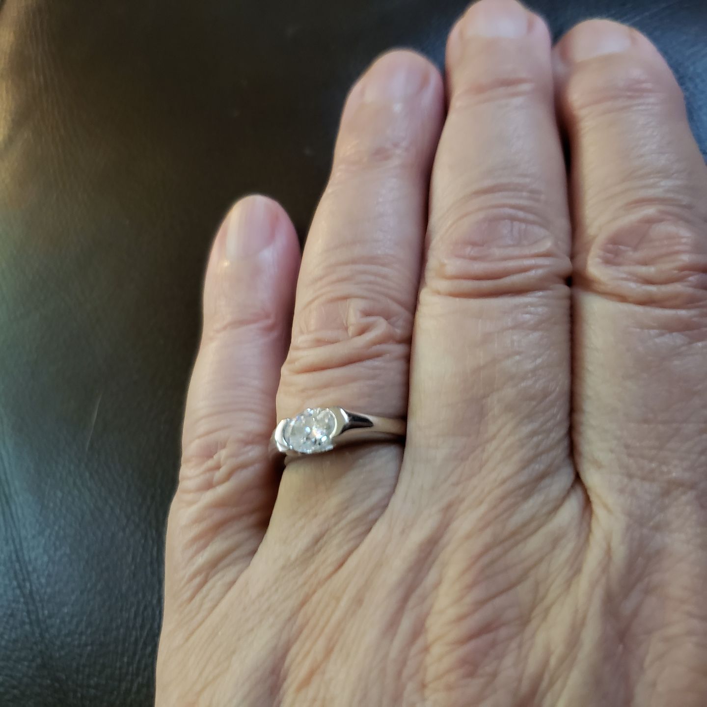Customer photo review of Solitaire Oval Moissanite Half Bezel Set Engagement Ring