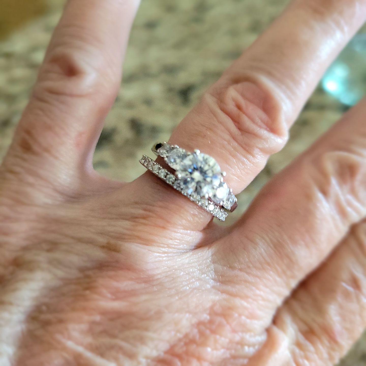 Customer photo review of Moissanite Round Half Eternity Sterling Silver Wedding Band Stackable Ring