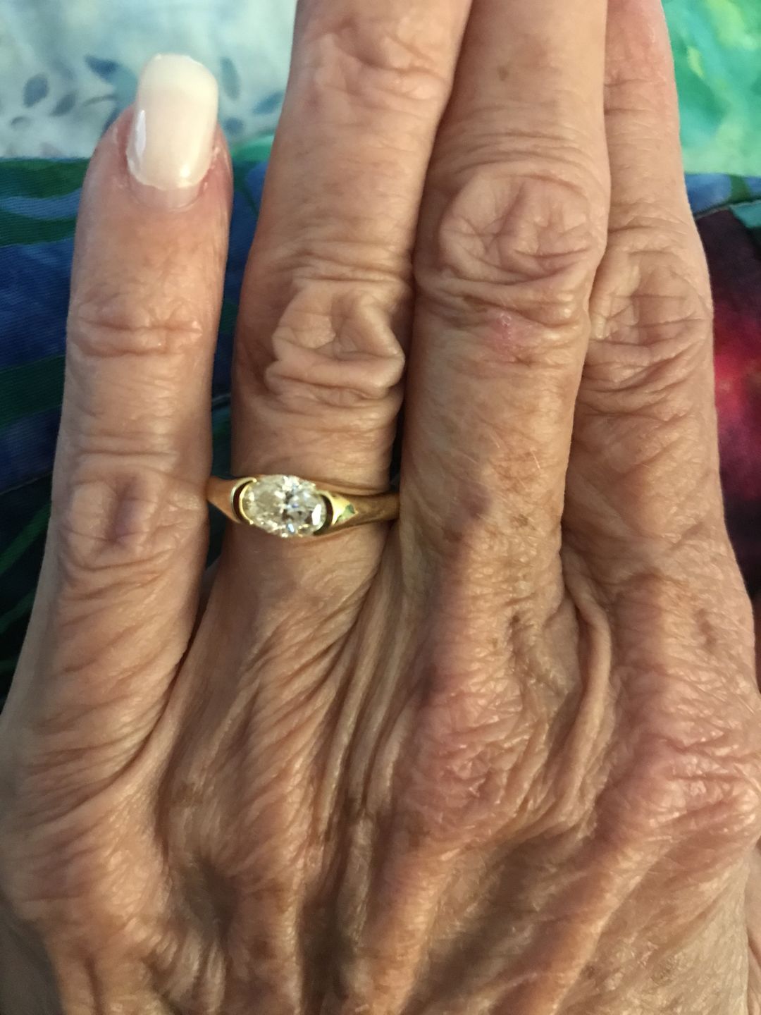 Customer photo review of Solitaire Oval Moissanite Half Bezel Set Engagement Ring