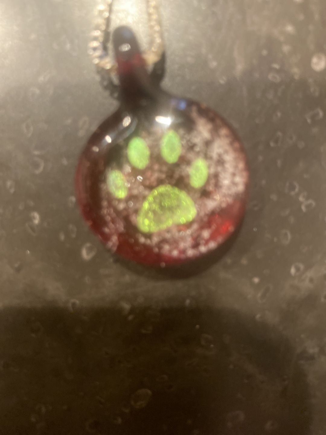 Customer photo review of Pawprint Foil Pendant with Cremation Ash