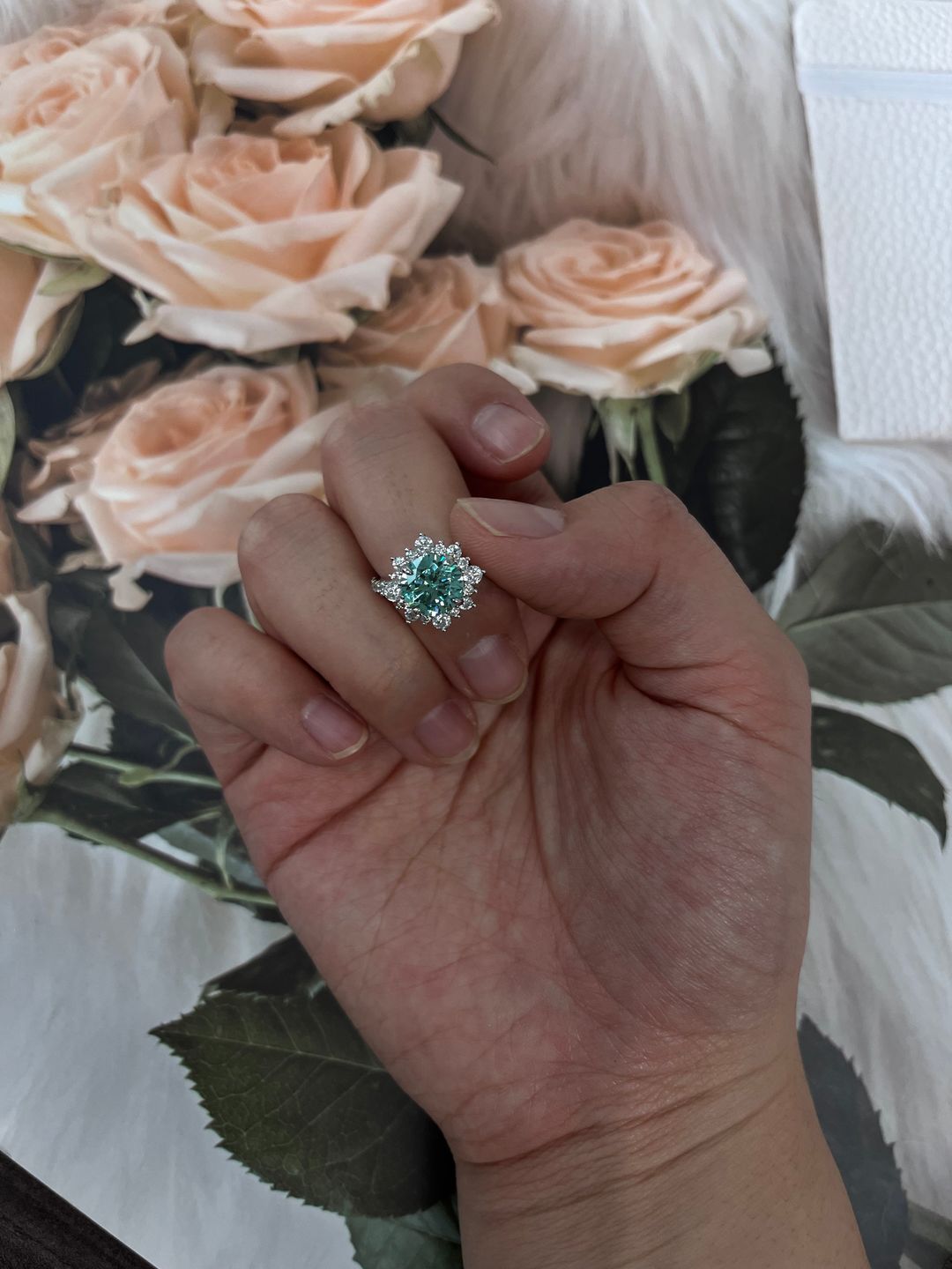 Customer photo review of S925 Moissanite 2 Ct Snowflake Design Halo Round Cyan Blue Stone Engagement Ring