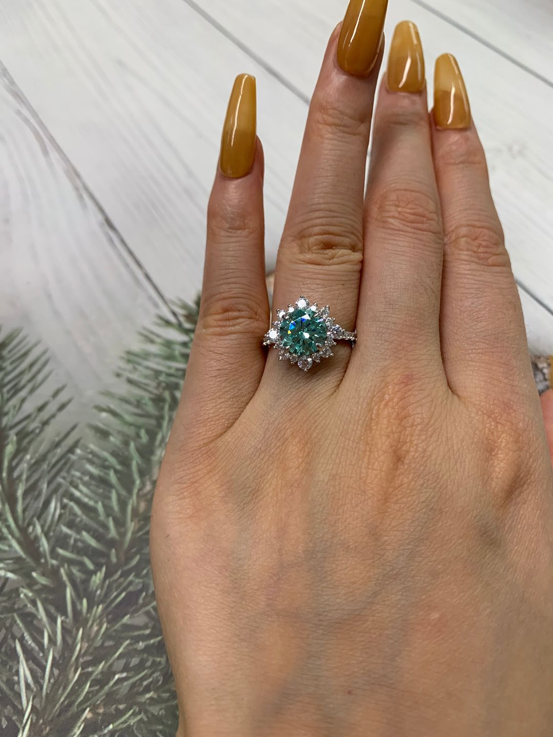Customer photo review of S925 Moissanite 2 Ct Snowflake Design Halo Round Cyan Blue Stone Engagement Ring
