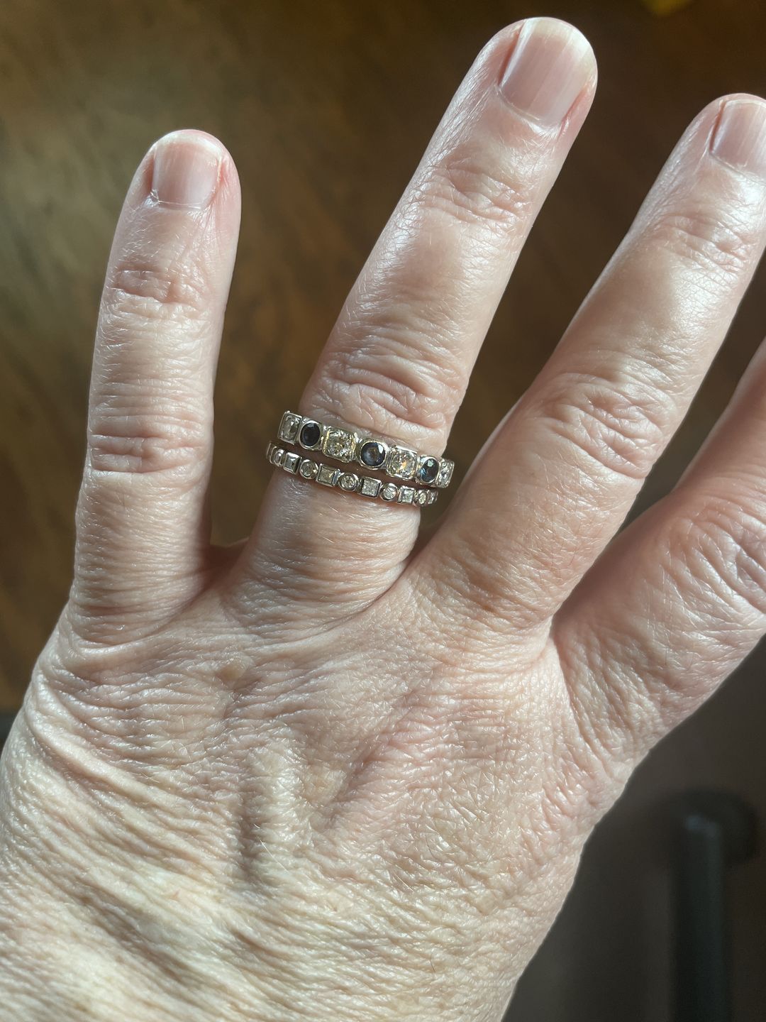 Customer photo review of Alternating Round And Princess Cut Moissanite Bezel Set Half Eternity Wedding Band