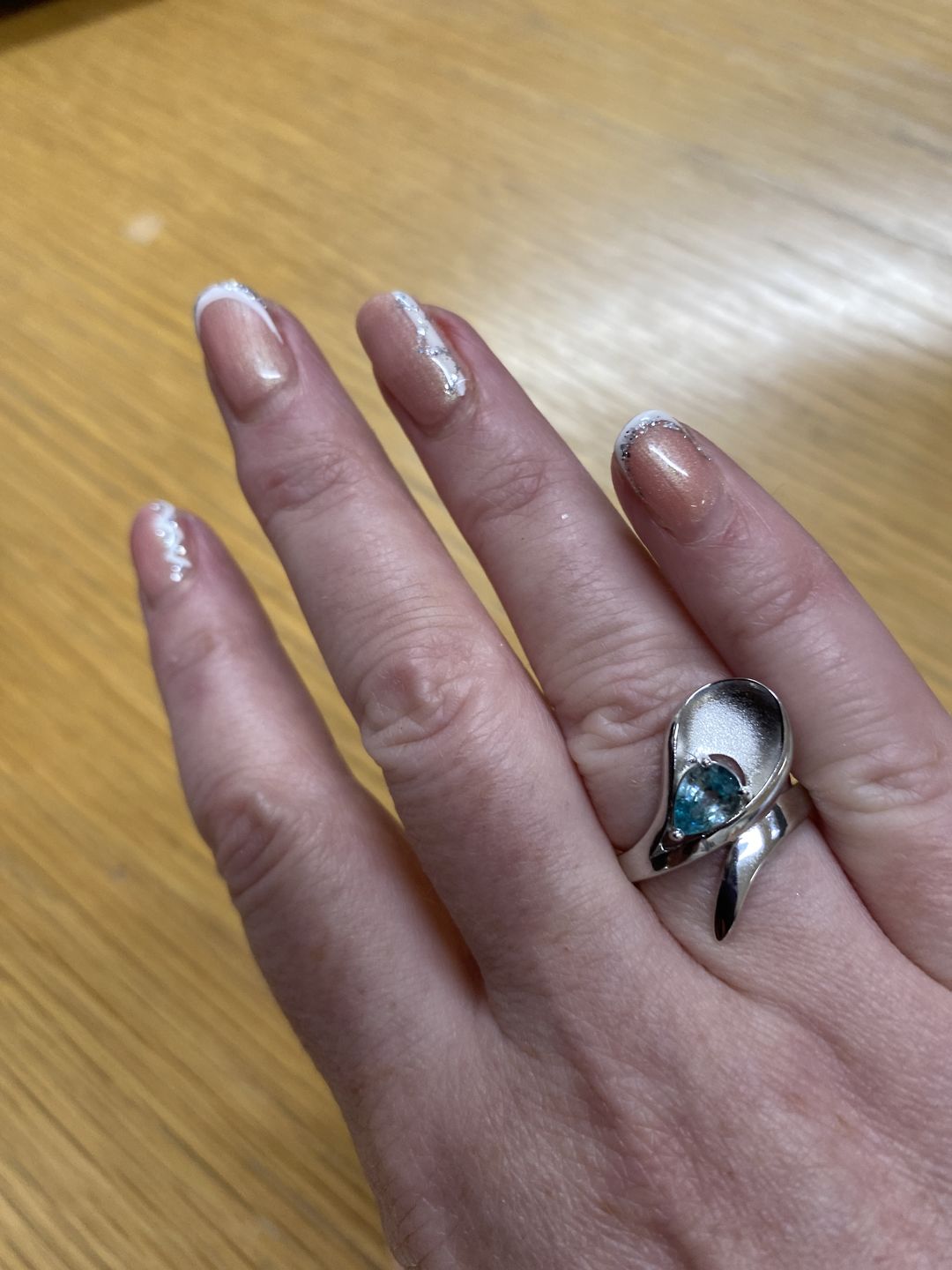 Customer photo review of Sandblast Texture Wave Earrings with Ratanakiri Blue Zircon