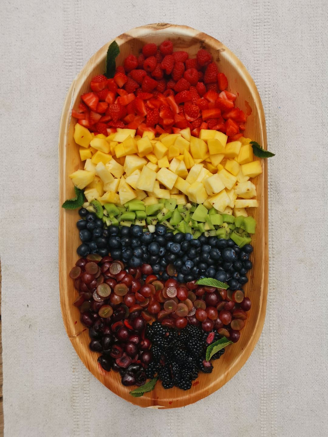 Customer photo review of Extra Large 22" x 12" Oval Disposable Palm Leaf Wooden Platter Tray