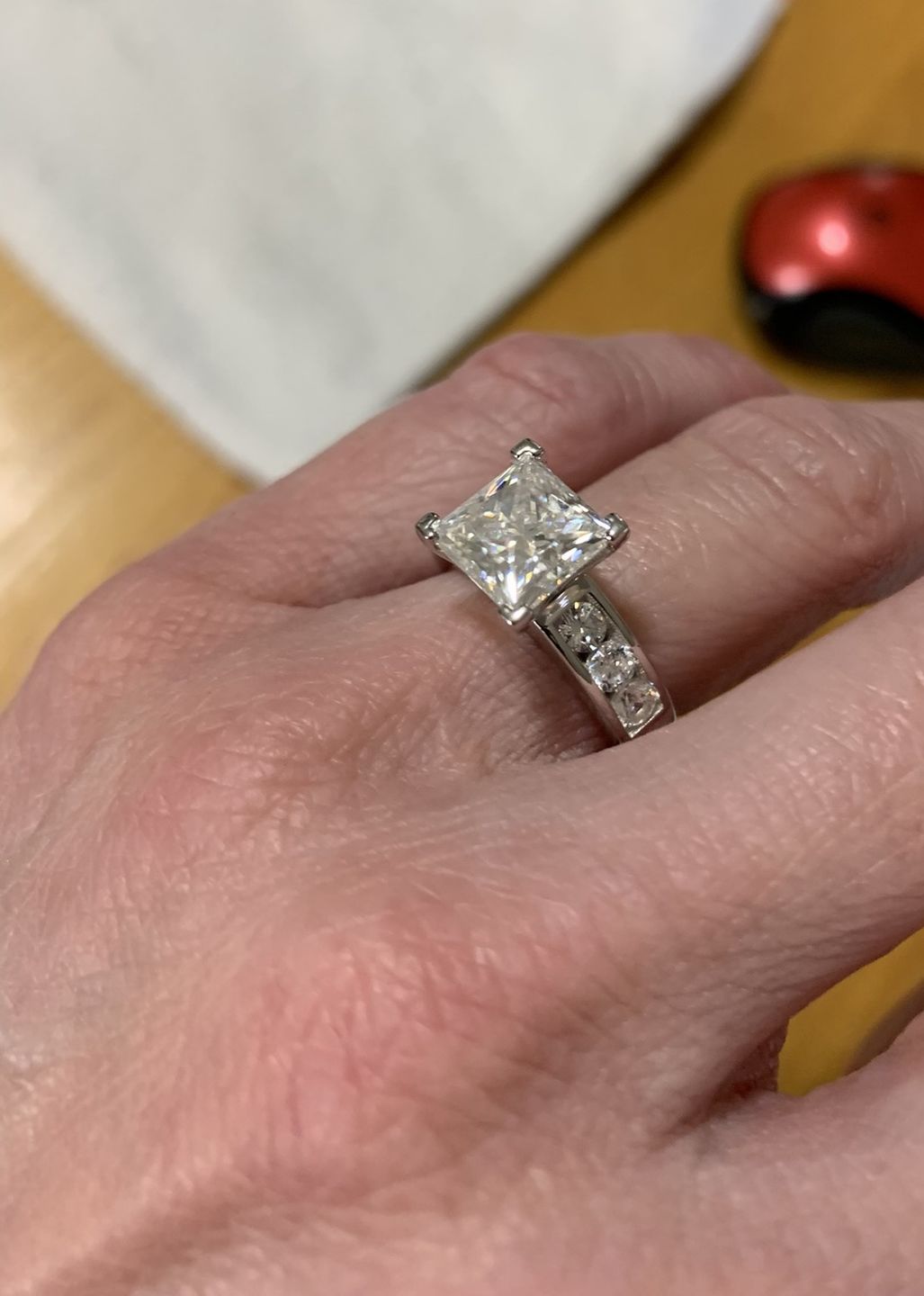 Customer photo review of Princess Cut Moissanite With Round Channel Set Engagement Ring