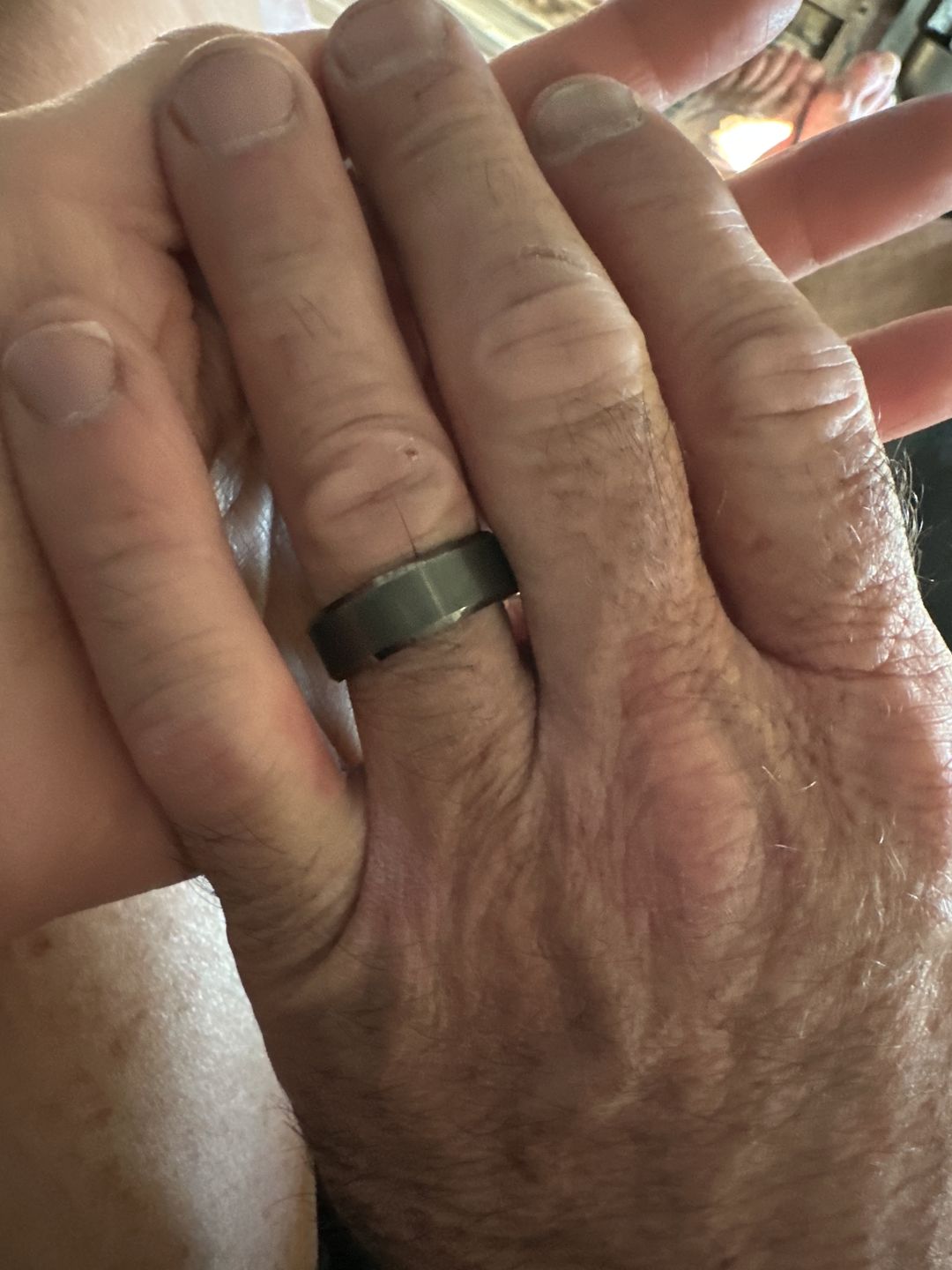 Customer photo review of 8mm GunMetal Tungsten Carbide Wedding Band with Beveled Edges