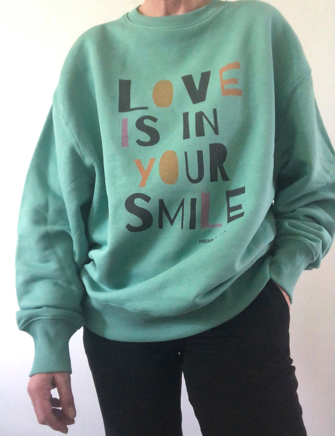 Customer photo review of Unisex Sweater "LOVE IS IN YOUR SMILE"