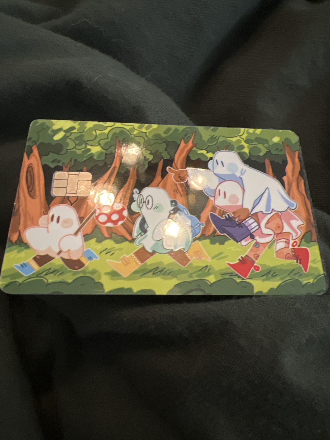 Customer photo review of Runaway Ghosts Credit Card Skins