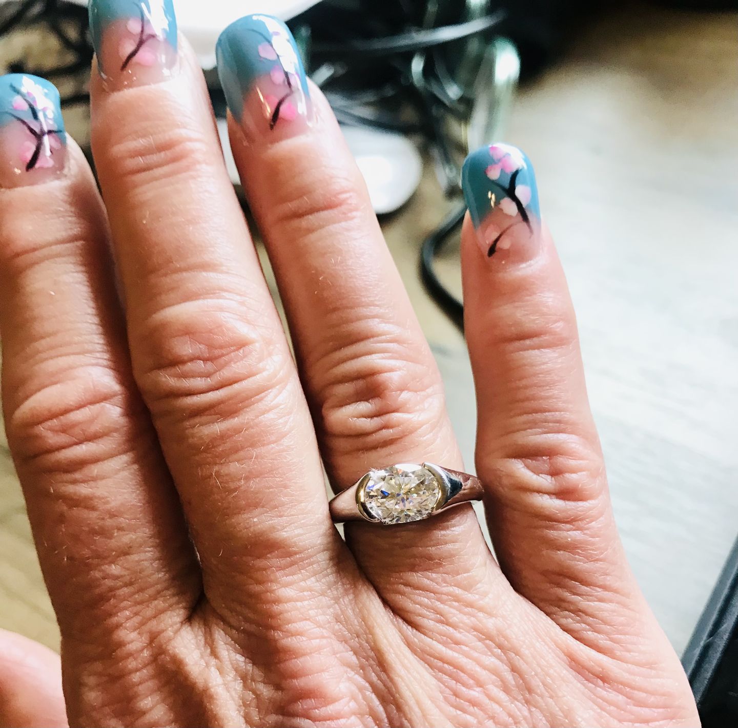 Customer photo review of Solitaire Oval Moissanite Half Bezel Set Engagement Ring