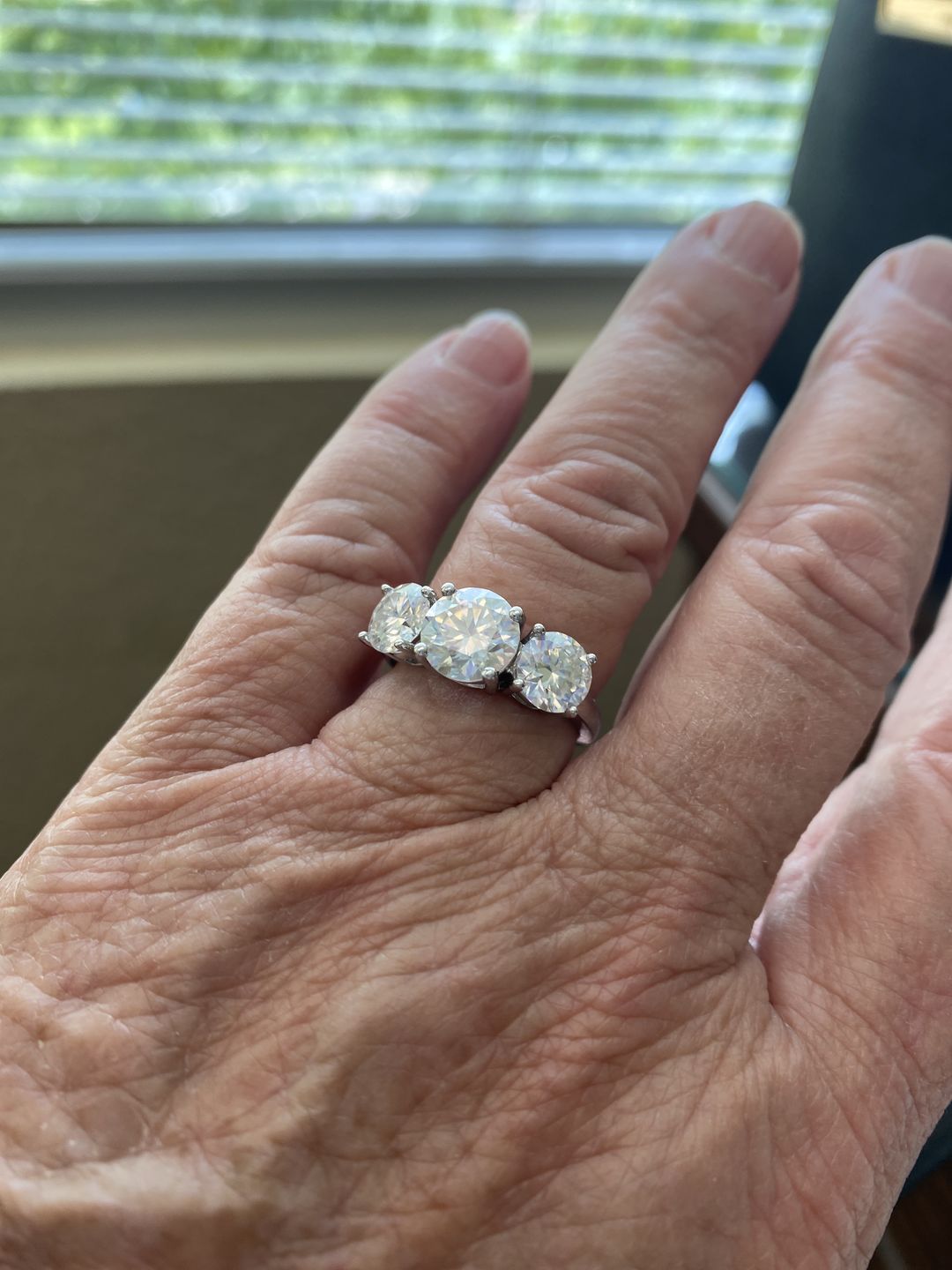 Customer photo review of Classic Three Stone Round Cut Moissanite Sterling Silver Wedding Ring