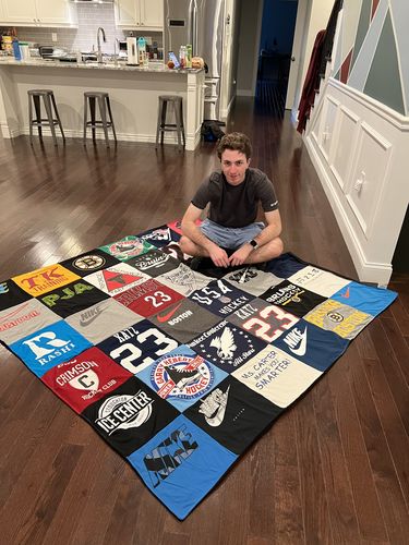 T-shirt quilt featuring swimmers team by Michelle from MA
