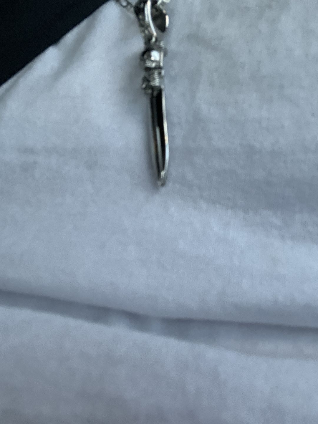 Customer photo review of CATACOMB SWORD PENDANT