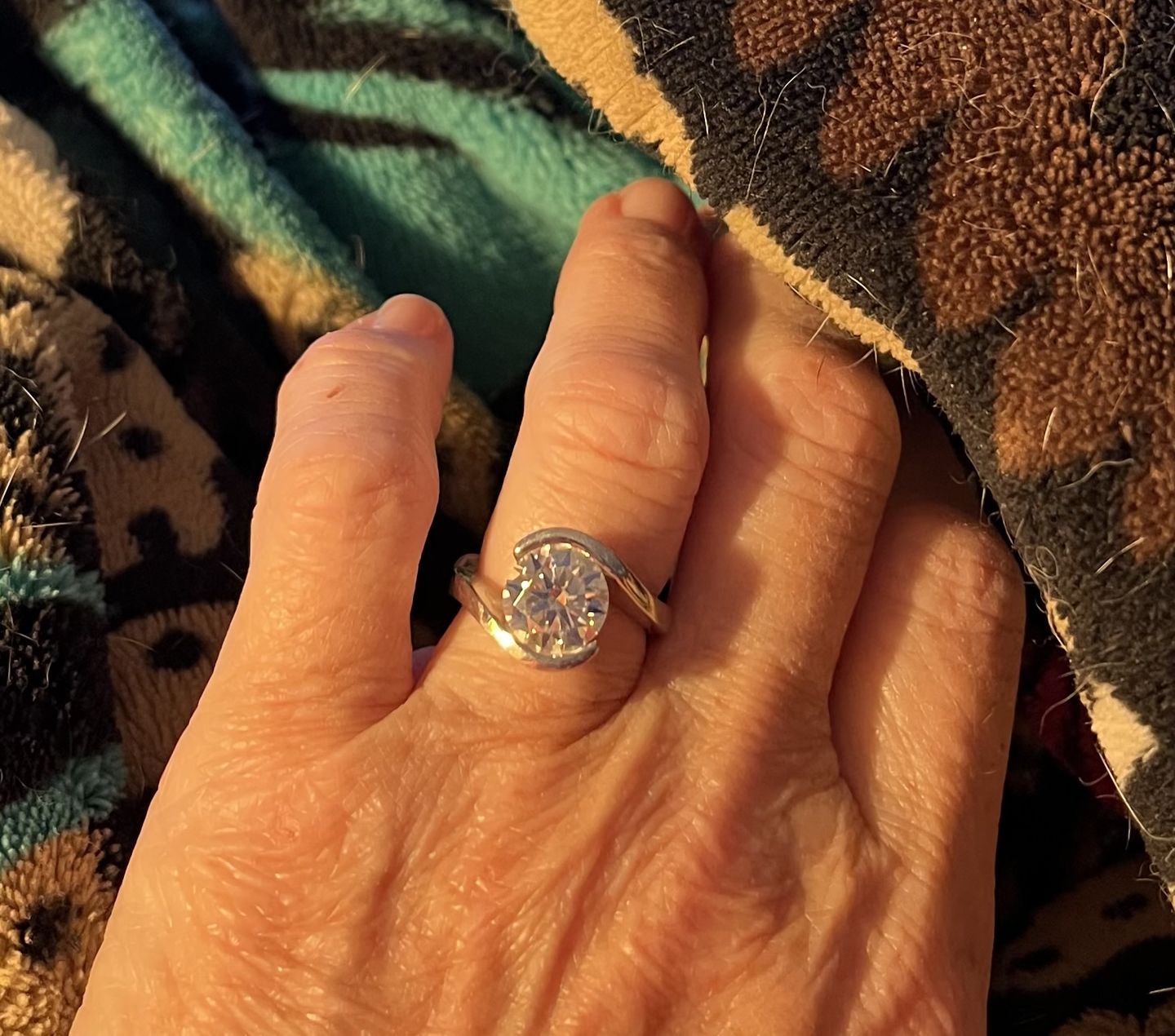 Customer photo review of Solitaire Tension Set Moissanite Bypass Engagement Ring
