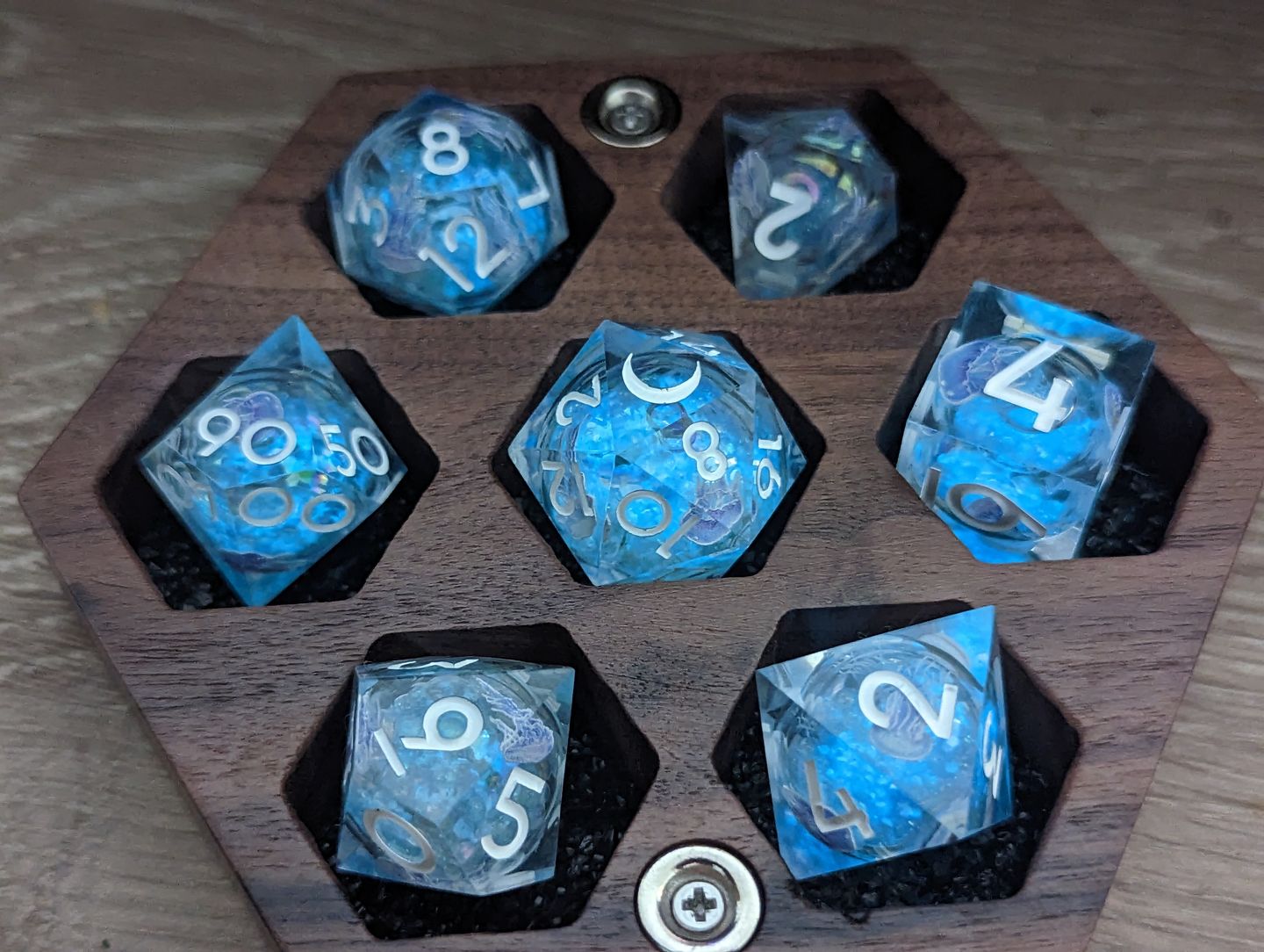 Customer photo review of URWizards D&D Glow in the Dark Liquid Core Resin Engraved Dice Set Jellyfish