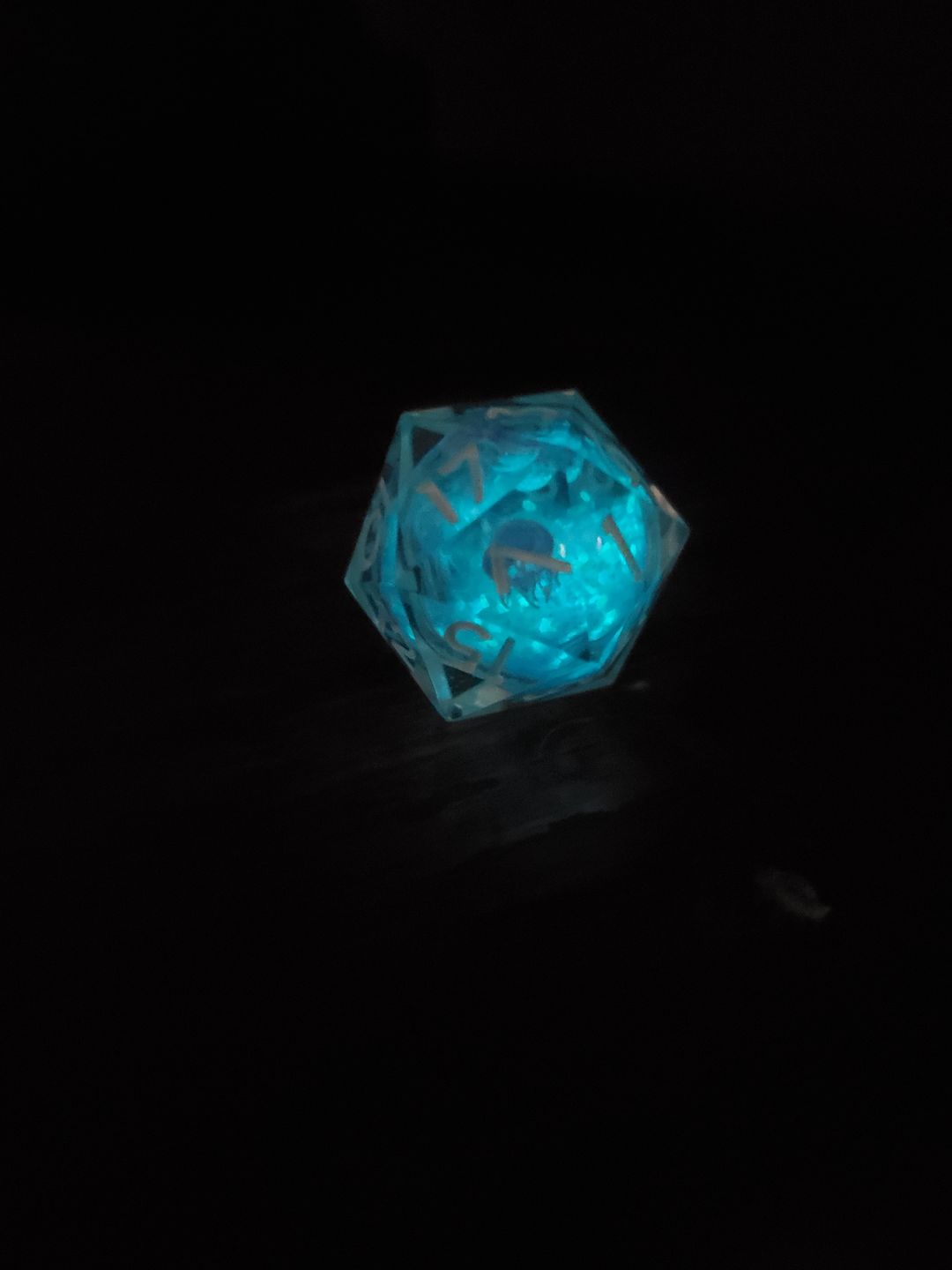 Customer photo review of URWizards D&D Glow in the Dark Liquid Core Resin Engraved Dice Set Jellyfish