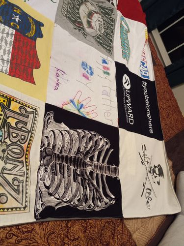 T-shirt quilt with art, music themes by Susan from NC