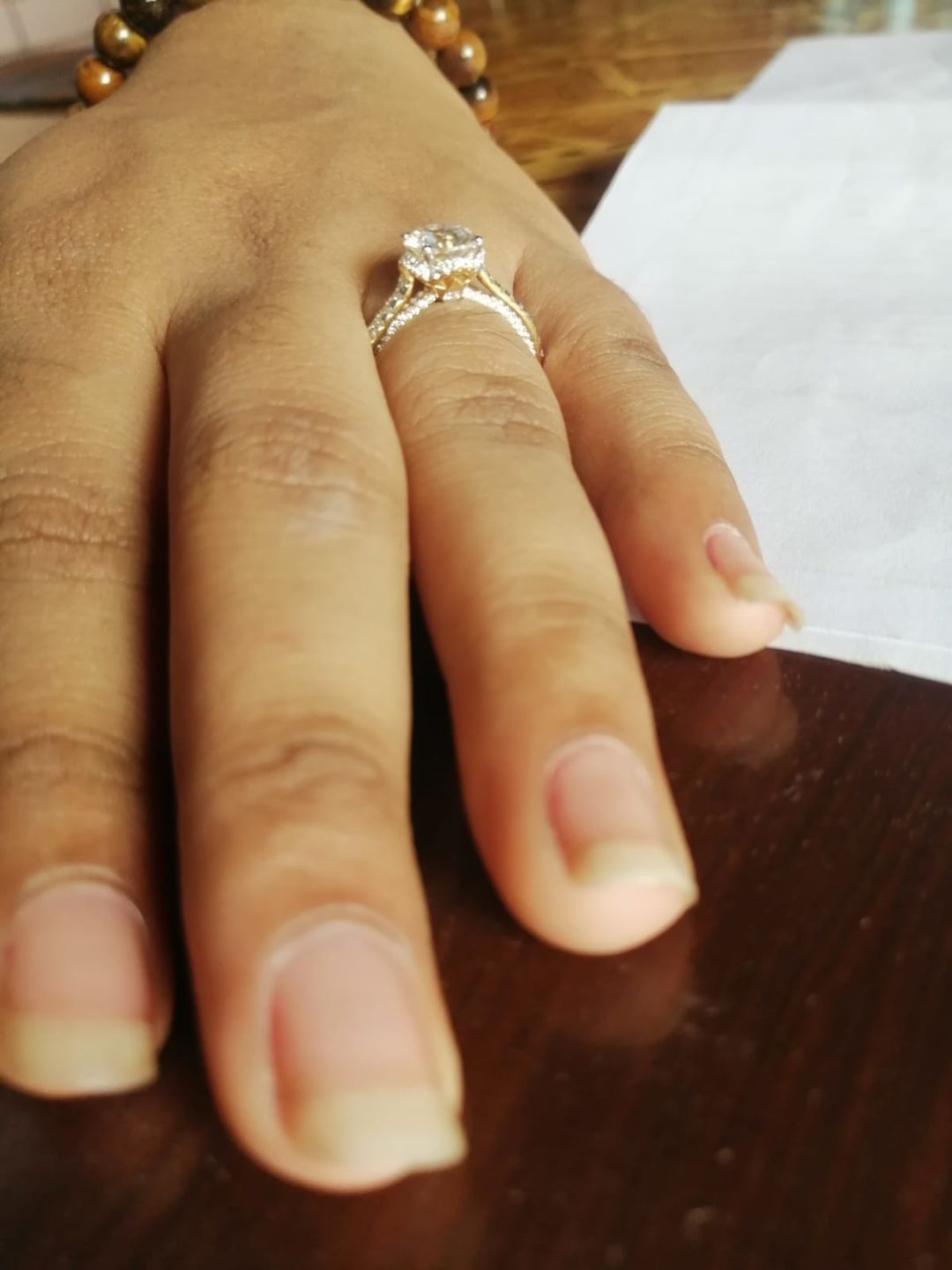 Customer photo review of Triumph Round Halo Moissanite Ring