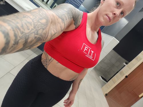Customer photo review of Salty Savage Ladies “FIT” Cropped Racerback Tank | Micro | Red/White