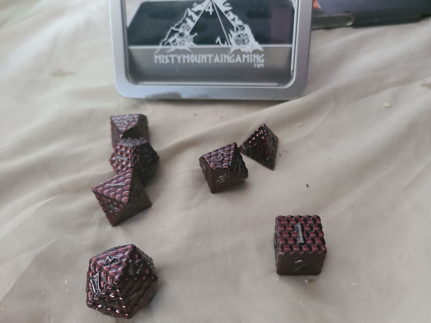 Customer photo review of DRAGON'S EGG BLOOD RED METAL DICE SET