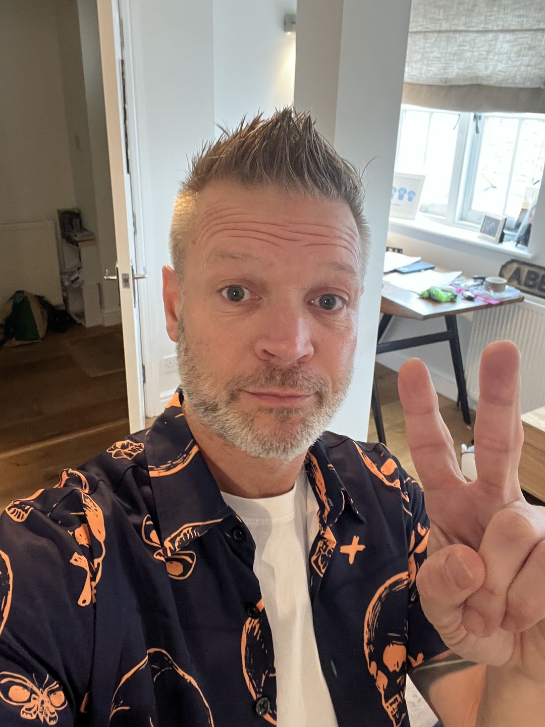 Customer photo review of Men's Orange Skull Print Art Graphic Button up Short Sleeve Aloha Hawaiian Shirt