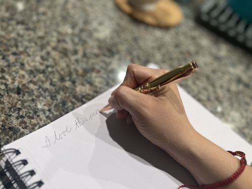 Customer photo review of .308 Real Bullet Casing Refillable Twist Pen - Tactical Gift Box - Polished Brass