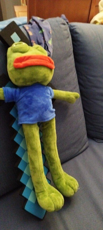 Customer photo review of Pepe The Frog Poseable Plushie 18" Sad Frog Meme Soft Stuffed Plush Toy: Hilarious Cuddle Buddy Meme Doll The Perfect Gift