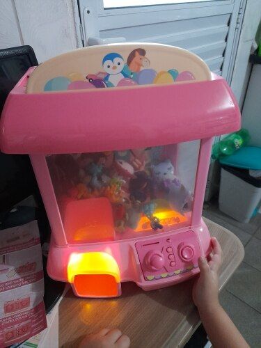 Customer photo review of Kawaii Mini Pink Green Light Up Claw Machine Toy