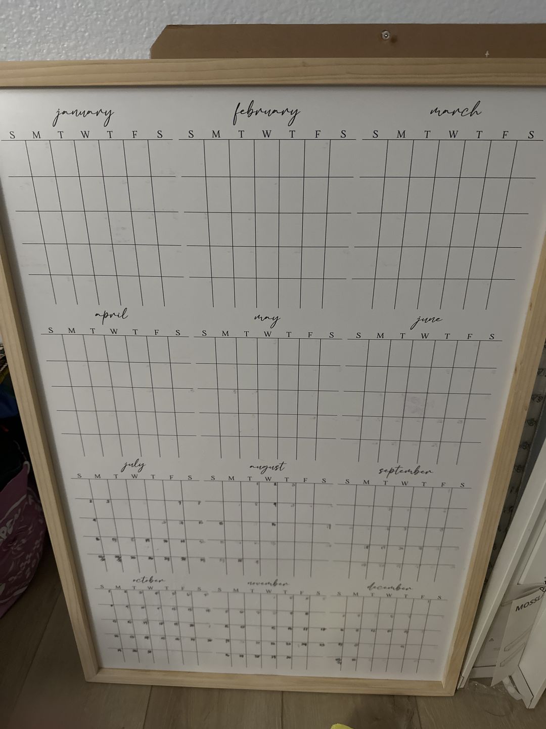 Customer photo review of Framed Yearly Whiteboard Calendar | Vertical Pennington