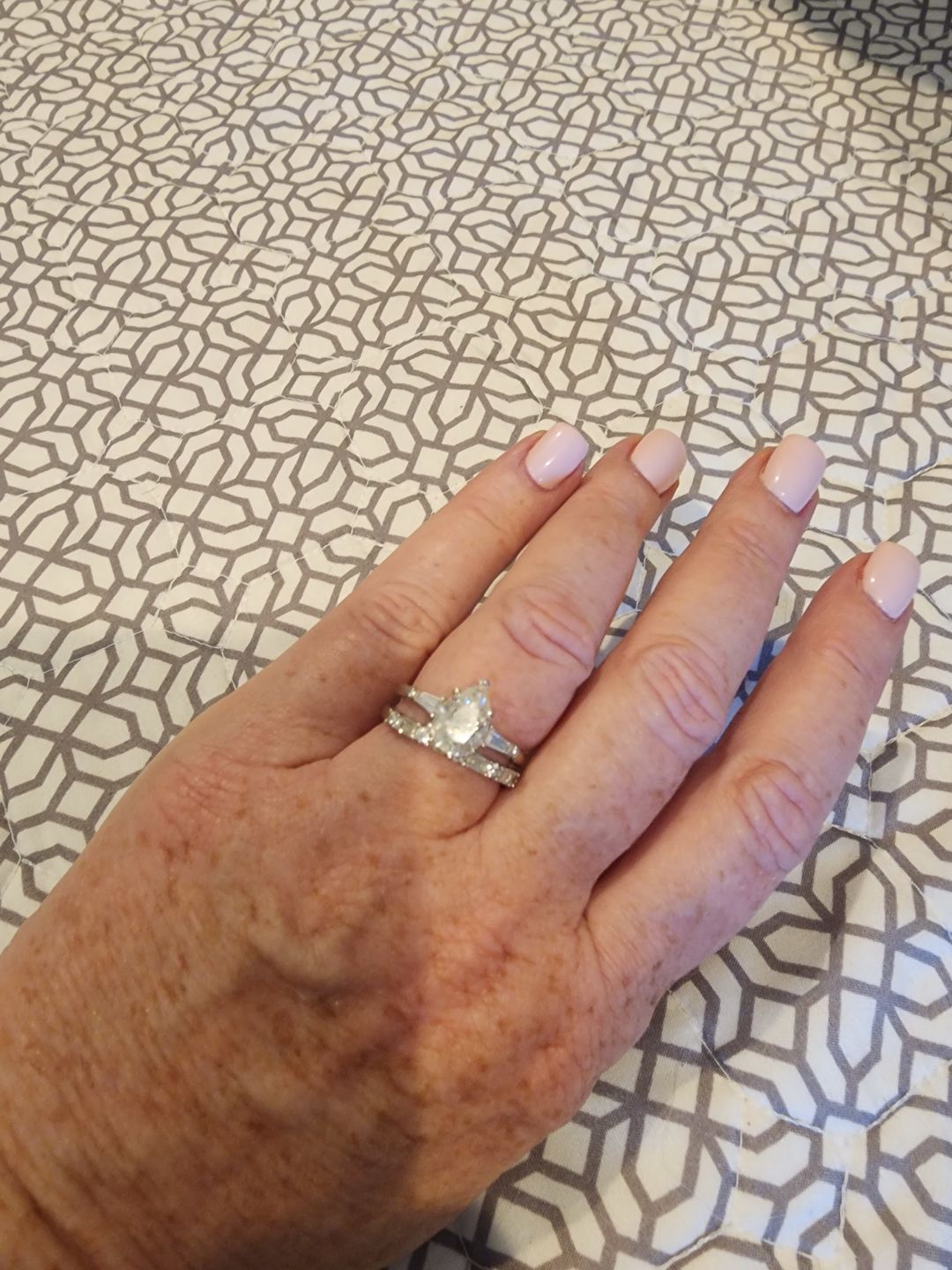 Customer photo review of Alternating Baguette and Round Moissanite Half Eternity Wedding Band