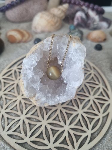 Customer photo review of Collier à perle d'oeil de tigre caramel en acier inoxydable