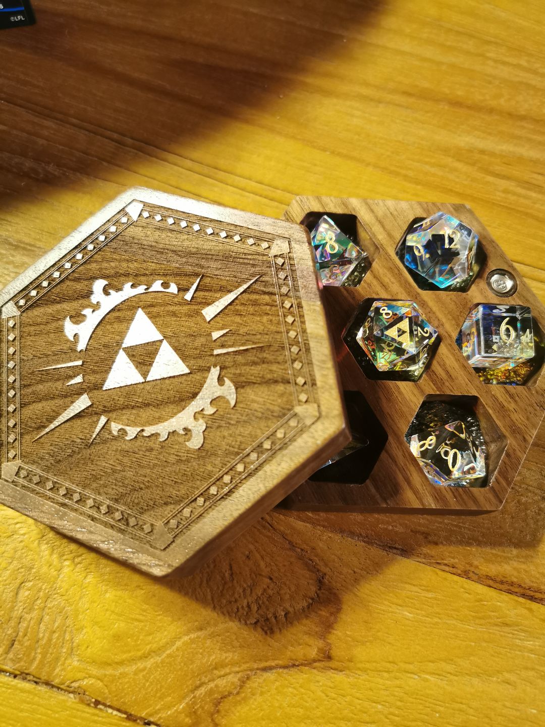 Customer photo review of URWizards D&D Dichroic Prism Glass Gemstone Engraved Dice Set Triforce