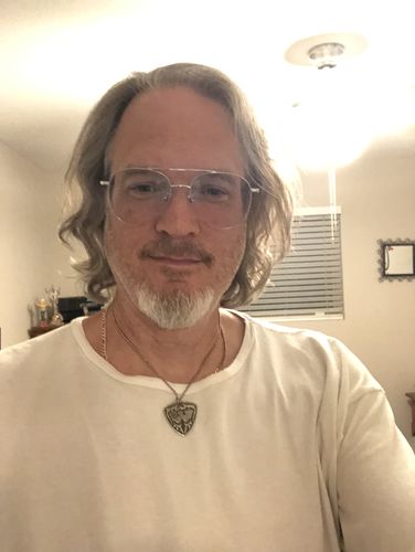 Customer photo review of Waylon Jennings Guitar Pick Necklace