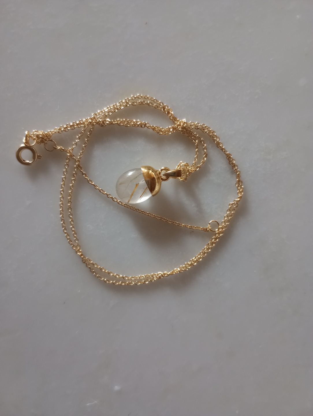 Customer photo review of Berlock Trumlad Rutilkvarts Guld