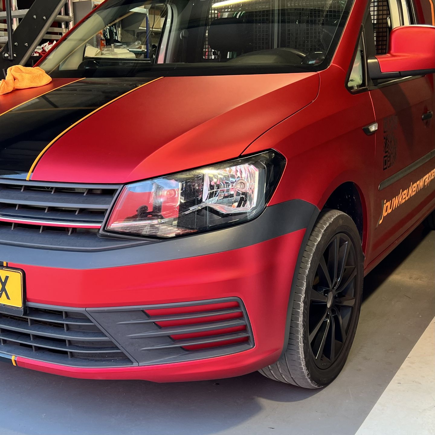 Customer photo review of Satin Chrome Prismatic Red Vinyl Wrap