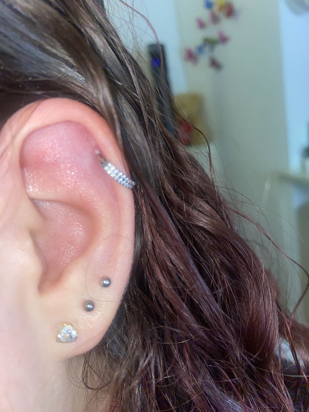Customer photo review of Double Conch Piercing | Titan
