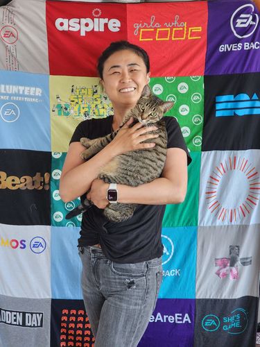 T-shirt quilt with coding, volunteer work themes by Sion from CA