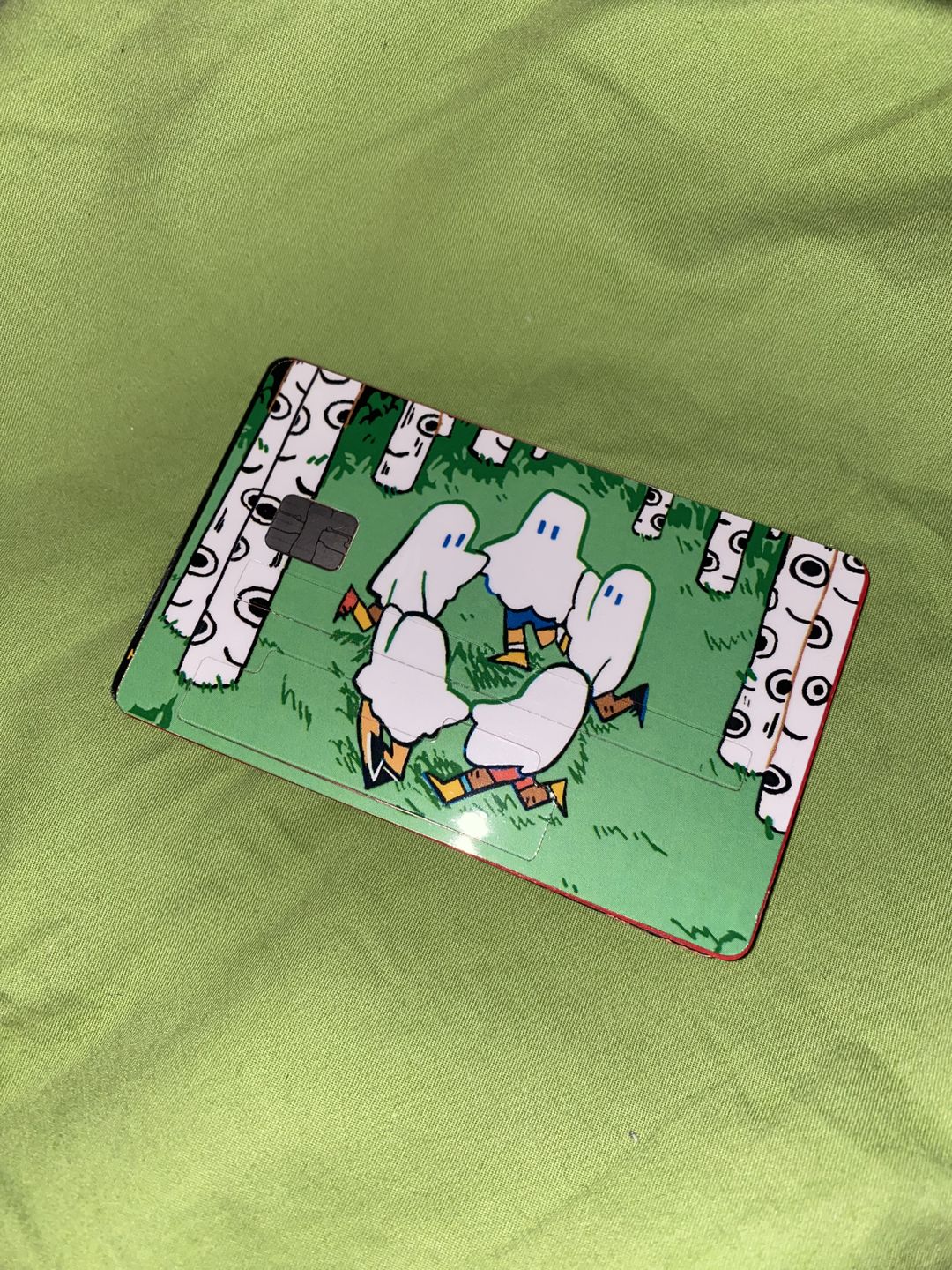 Customer photo review of Circle Ghosts Credit Card Skins