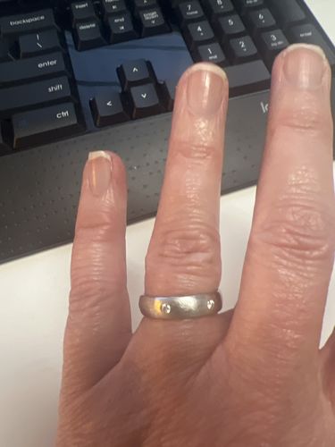 Customer photo review of Flush Set Moissanite Matte Brush Eternity Wedding Band