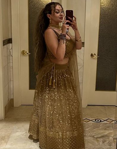 Customer photo review of Golden Color Soft Net Wedding Wear Designer Lehenga